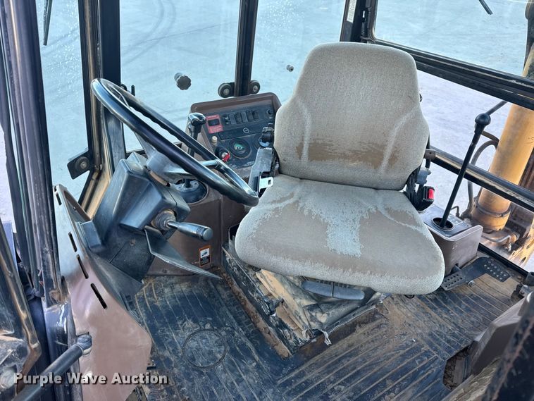 image for item EN0884 1999 John Deere 310SE backhoe