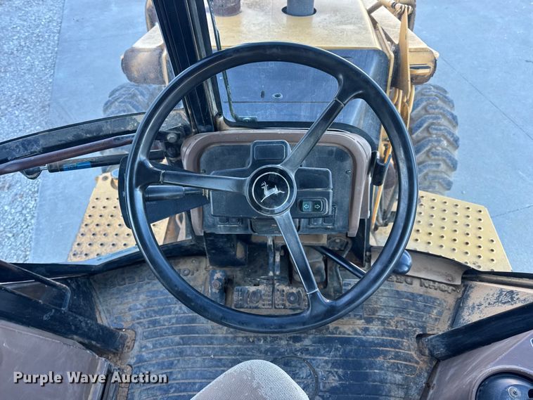 image for item EN0884 1999 John Deere 310SE backhoe