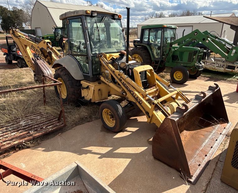 image for item ES5652 1997 New Holland 555E backhoe