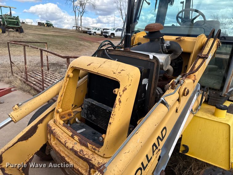 image for item ES5652 1997 New Holland 555E backhoe
