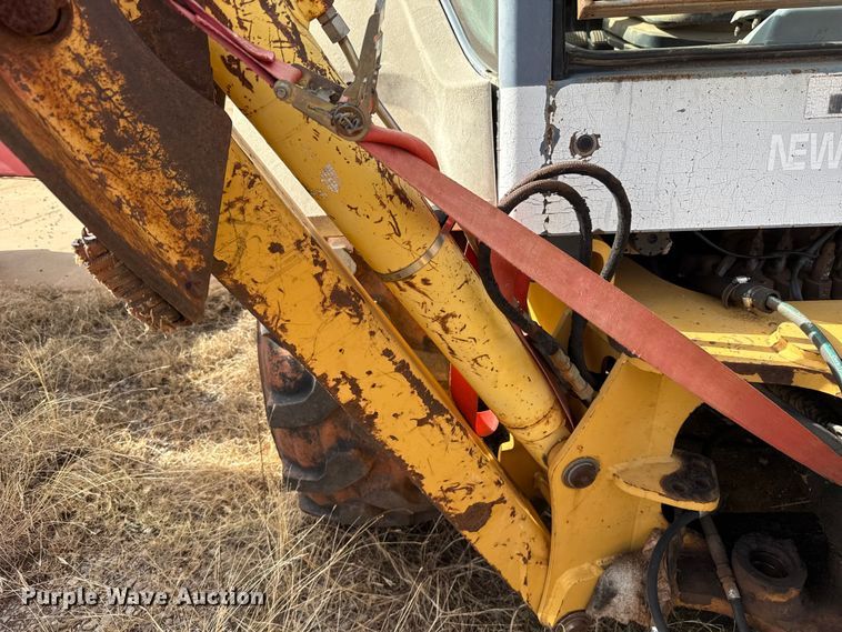 image for item ES5652 1997 New Holland 555E backhoe