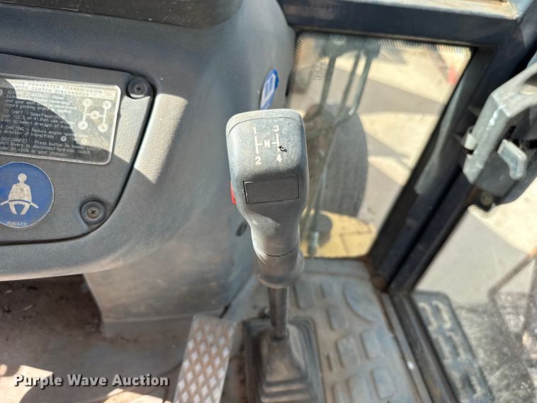 image for item ES5652 1997 New Holland 555E backhoe