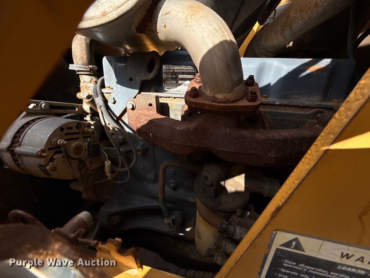 image for item ES5652 1997 New Holland 555E backhoe
