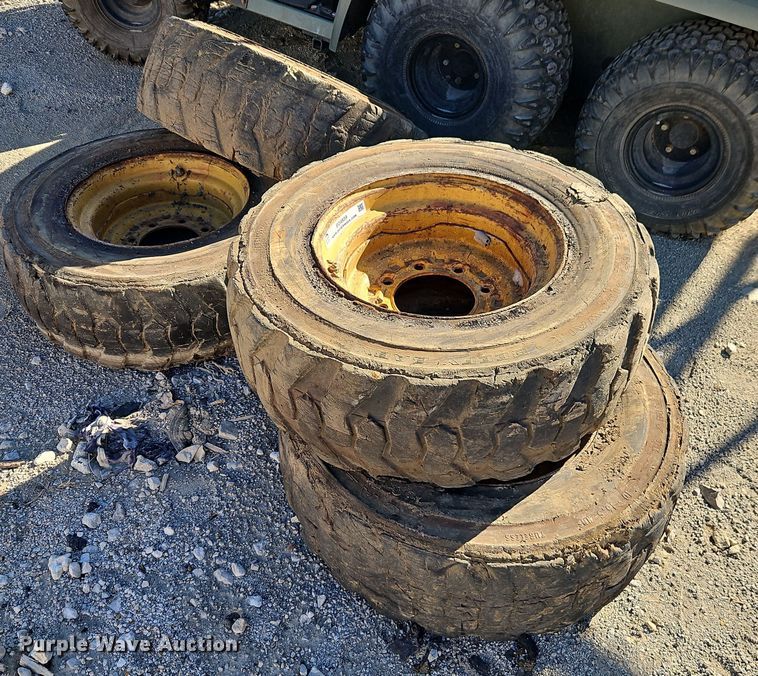 image for item EO4939 (4) 10x16.5 skid steer wheels and tires