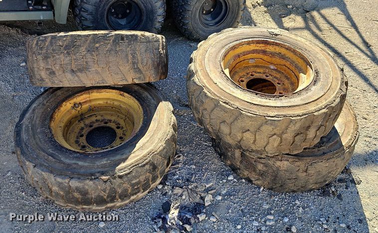image for item EO4939 (4) 10x16.5 skid steer wheels and tires