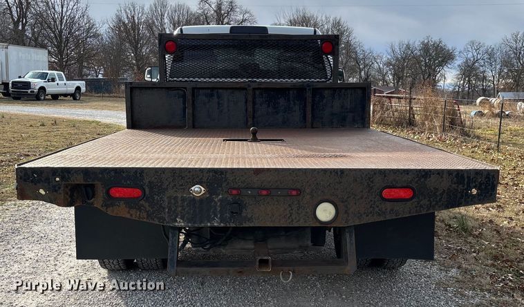 image for item FG0023 2013 RAM 3500 Crew Cab flatbed pickup truck