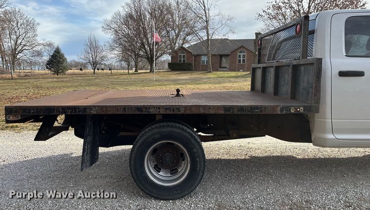 image for item FG0023 2013 RAM 3500 Crew Cab flatbed pickup truck