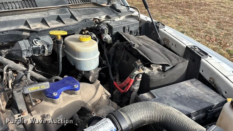 image for item FG0023 2013 RAM 3500 Crew Cab flatbed pickup truck