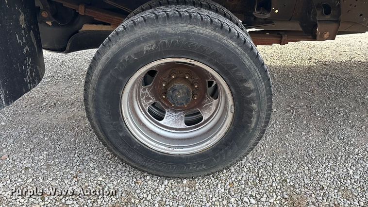 image for item FG0023 2013 RAM 3500 Crew Cab flatbed pickup truck