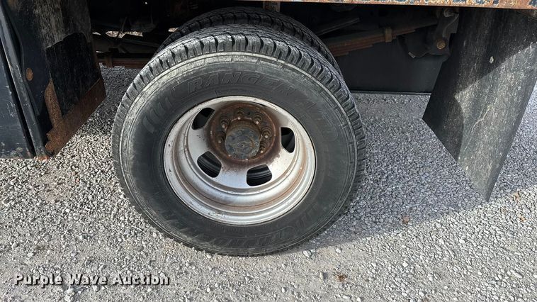 image for item FG0023 2013 RAM 3500 Crew Cab flatbed pickup truck