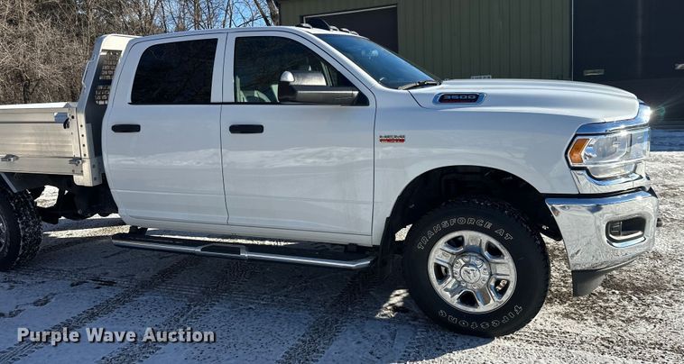 image for item DW4419 2022 RAM 3500 Crew Cab flatbed pickup truck