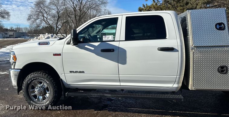 image for item DW4421 2022 RAM 3500 Crew Cab flatbed pickup truck