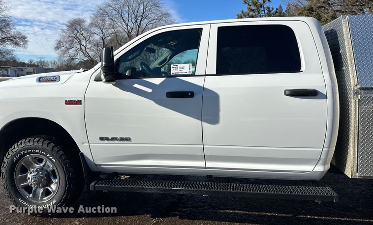 image for item DW4421 2022 RAM 3500 Crew Cab flatbed pickup truck