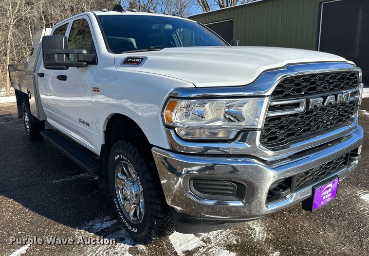 image for item DW4421 2022 RAM 3500 Crew Cab flatbed pickup truck