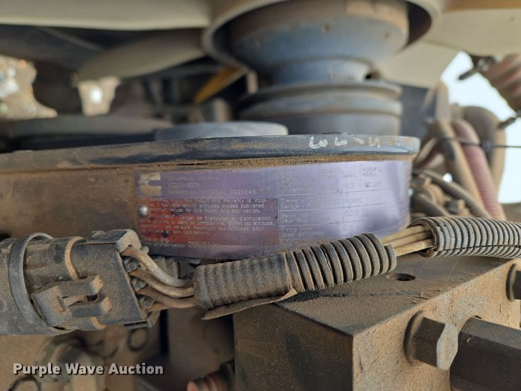 image for item ET1176 2002 Freightliner FL70 flatbed truck