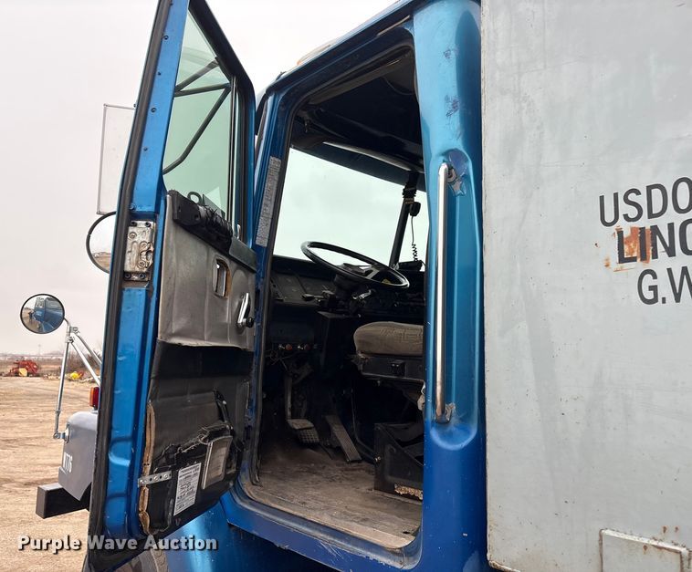 image for item FG2640 1997 Volvo WG-64T flatbed truck