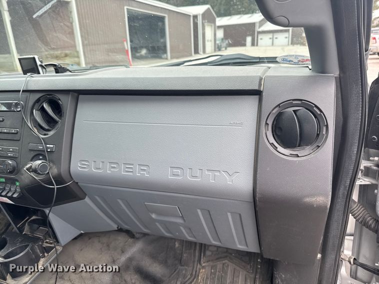 image for item OE9529 2016 Ford F550 Super Duty hook lift truck