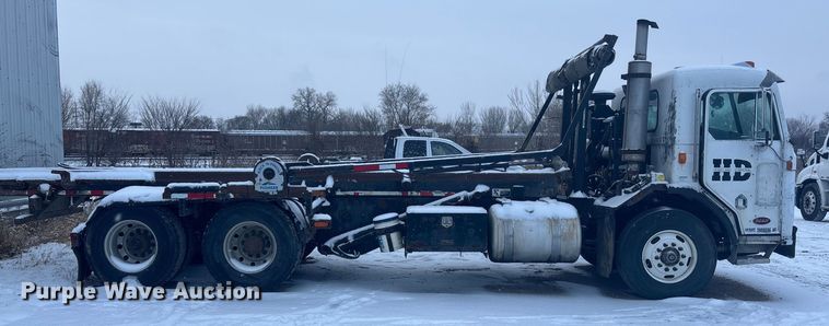 image for item DK0202 2002 Peterbilt 320 roll-off container truck