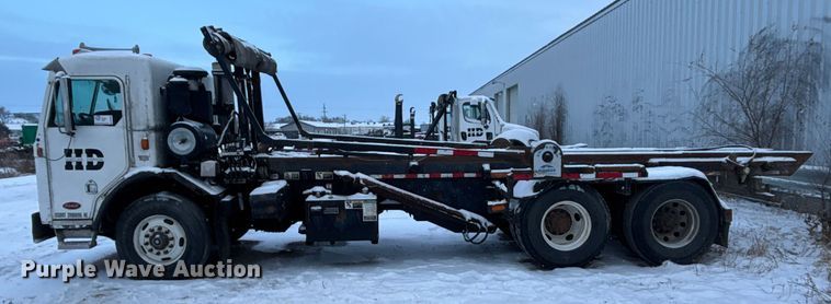image for item DK0202 2002 Peterbilt 320 roll-off container truck
