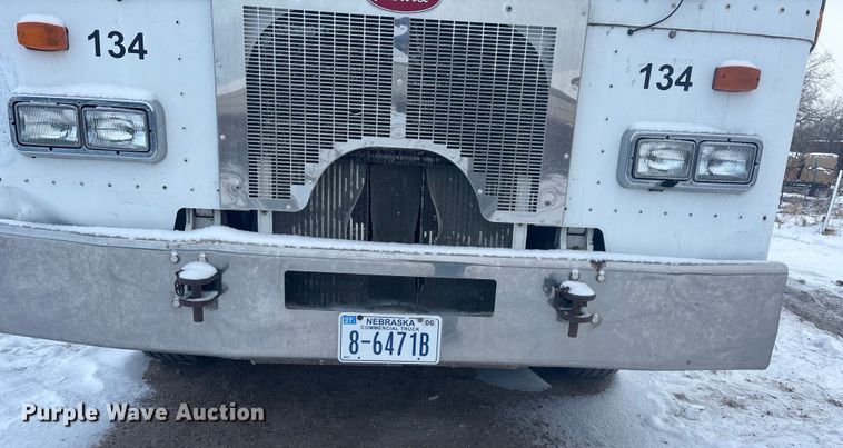 image for item DK0202 2002 Peterbilt 320 roll-off container truck