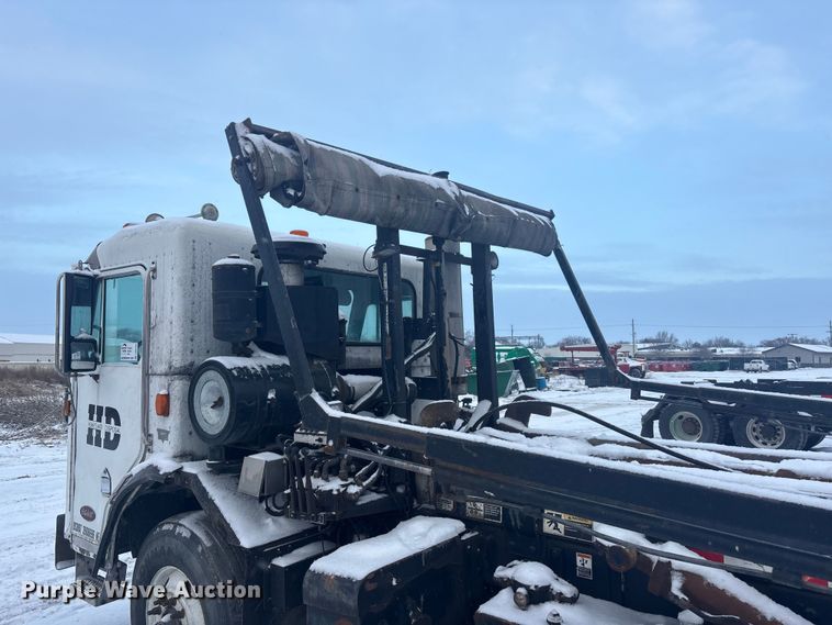 image for item DK0202 2002 Peterbilt 320 roll-off container truck