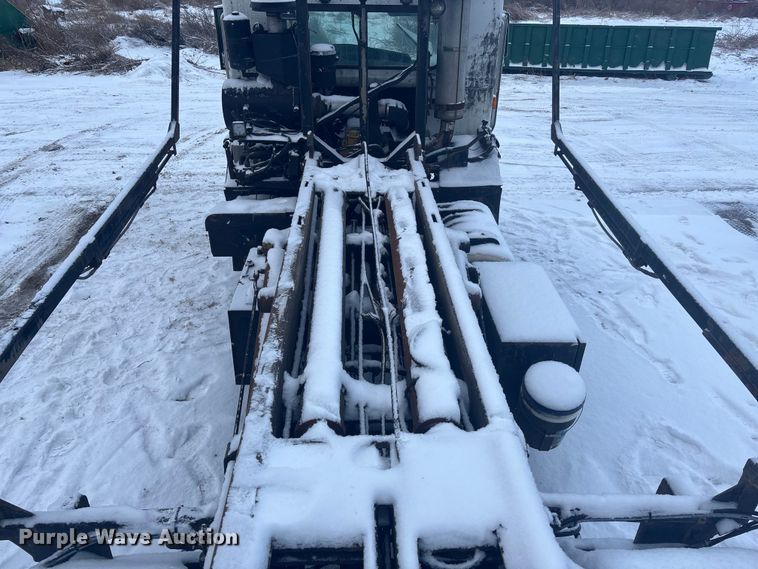 image for item DK0202 2002 Peterbilt 320 roll-off container truck