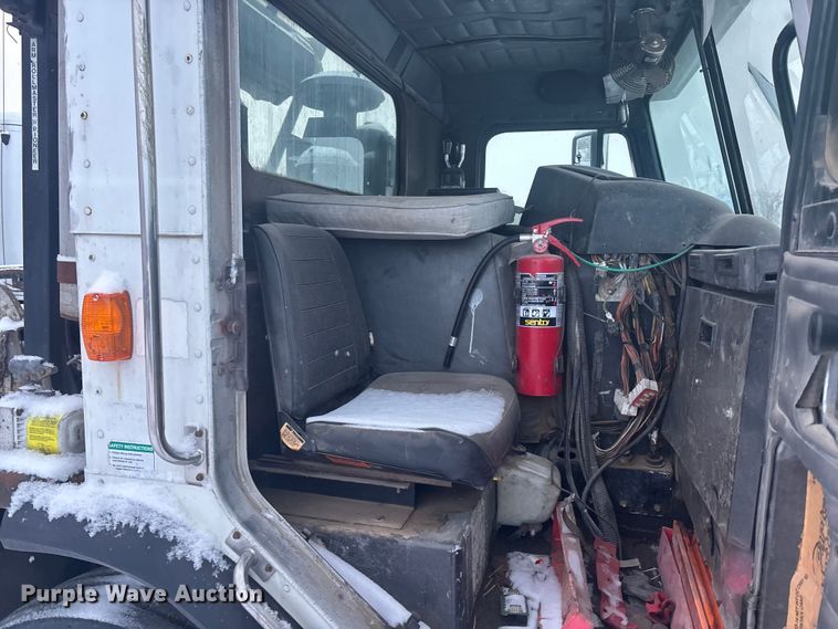 image for item DK0202 2002 Peterbilt 320 roll-off container truck