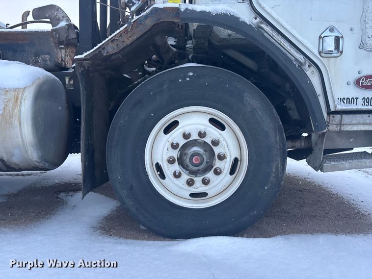 image for item DK0202 2002 Peterbilt 320 roll-off container truck