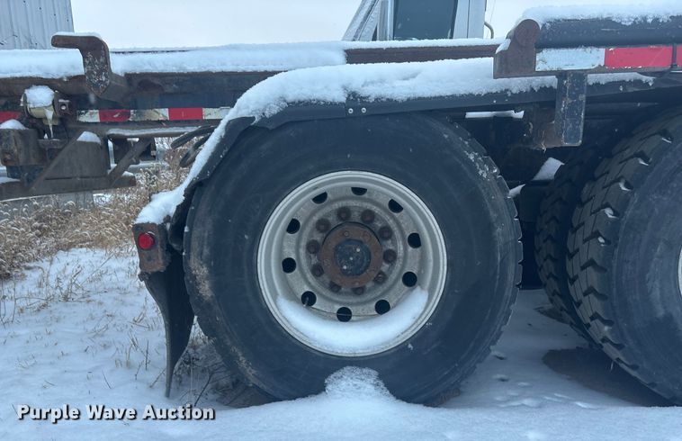 image for item DK0202 2002 Peterbilt 320 roll-off container truck