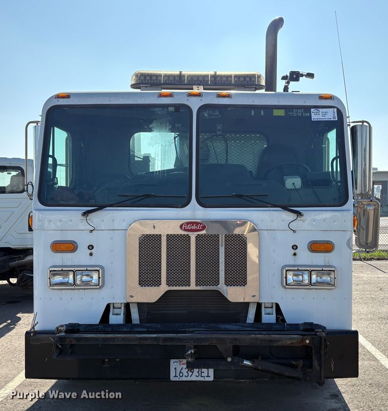 image for item EC8214 2013 Peterbilt 320 flatbed truck