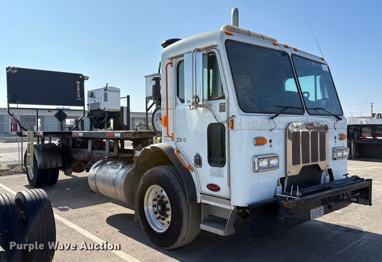 image for item EC8214 2013 Peterbilt 320 flatbed truck