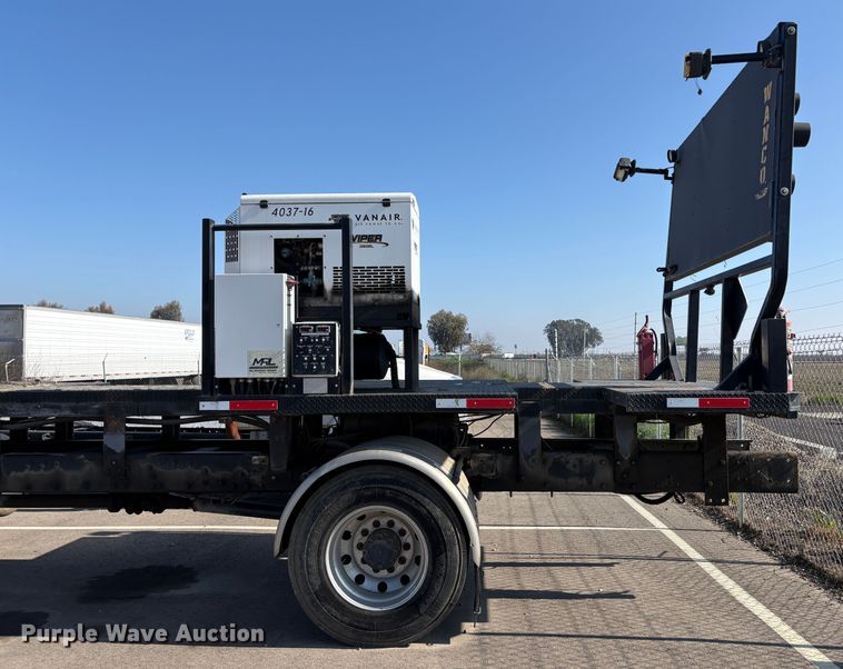 image for item EC8214 2013 Peterbilt 320 flatbed truck