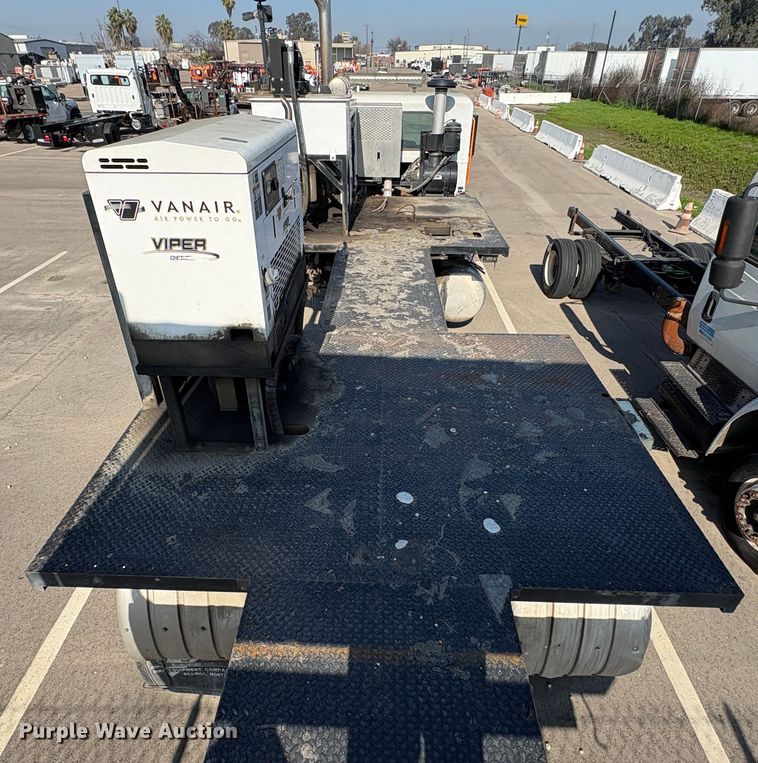 image for item EC8214 2013 Peterbilt 320 flatbed truck