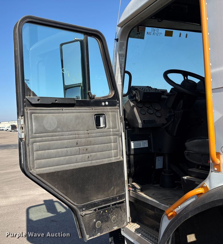 image for item EC8214 2013 Peterbilt 320 flatbed truck