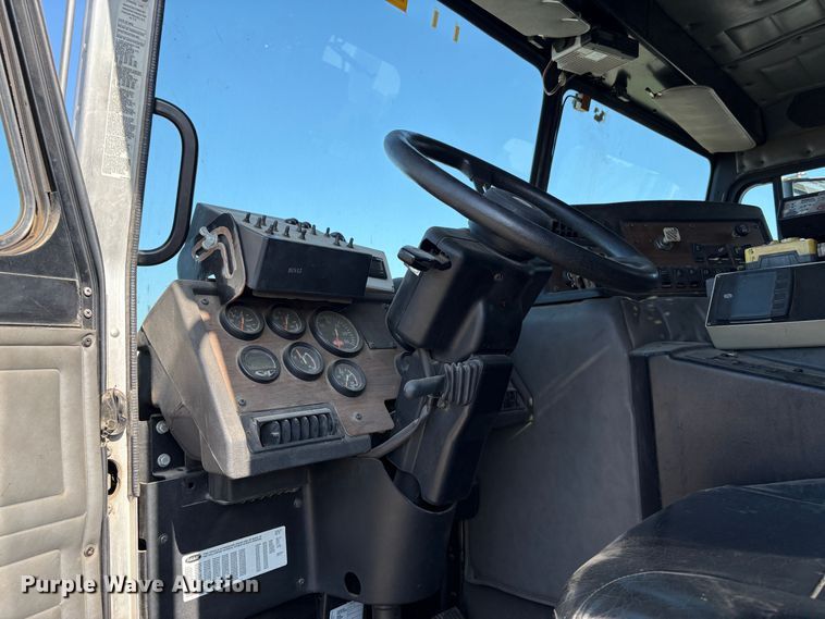 image for item EC8214 2013 Peterbilt 320 flatbed truck