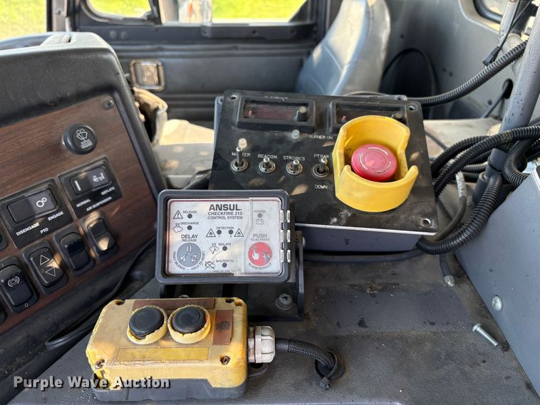 image for item EC8214 2013 Peterbilt 320 flatbed truck