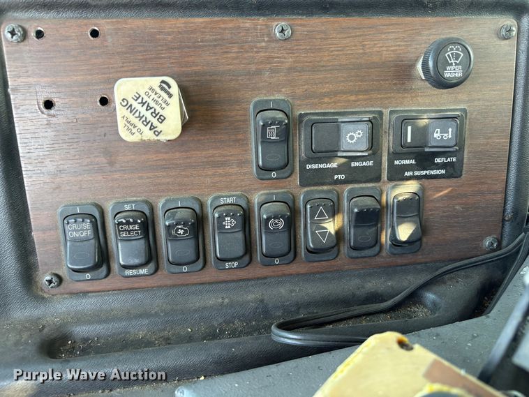 image for item EC8214 2013 Peterbilt 320 flatbed truck