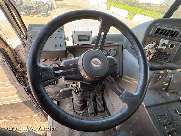 image for item EC8214 2013 Peterbilt 320 flatbed truck