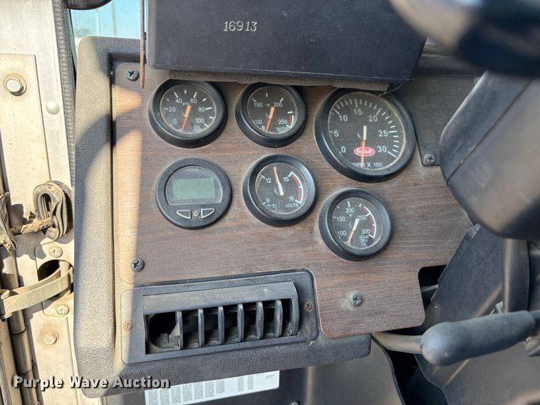 image for item EC8214 2013 Peterbilt 320 flatbed truck