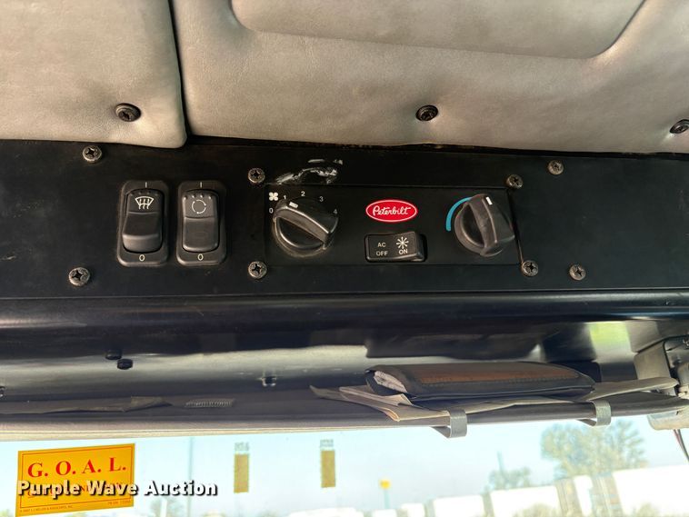 image for item EC8214 2013 Peterbilt 320 flatbed truck