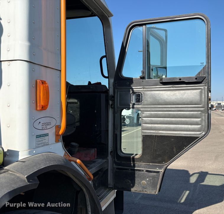 image for item EC8214 2013 Peterbilt 320 flatbed truck