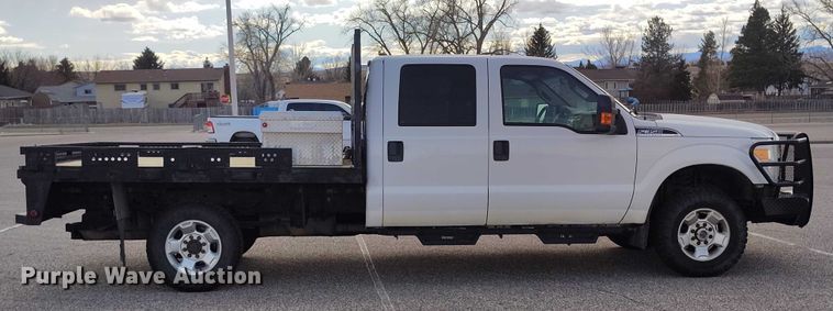 image for item DT0919 2012 Ford F350 Super Duty  Crew Cab flatbed pickup truck