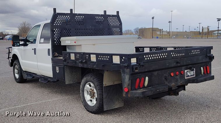 image for item DT0919 2012 Ford F350 Super Duty  Crew Cab flatbed pickup truck