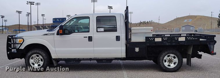 image for item DT0919 2012 Ford F350 Super Duty  Crew Cab flatbed pickup truck