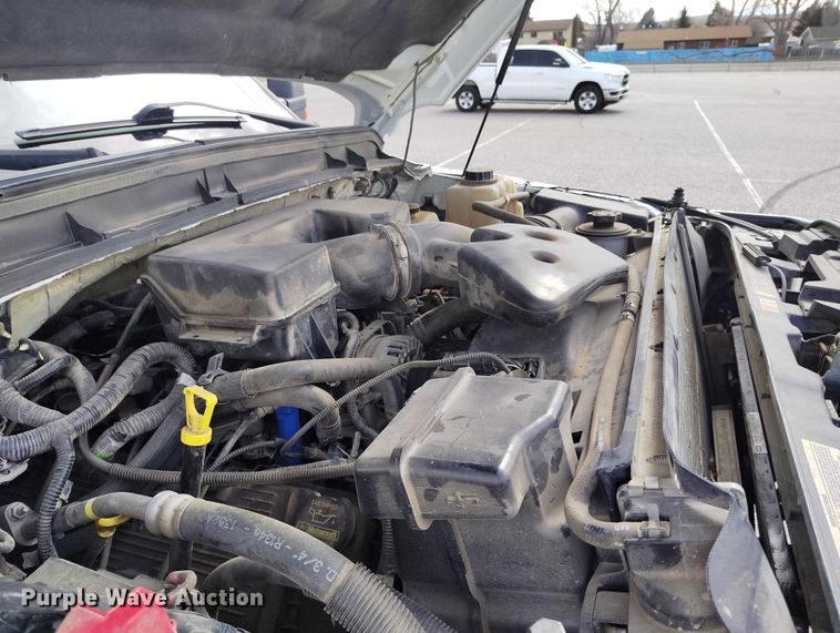 image for item DT0919 2012 Ford F350 Super Duty  Crew Cab flatbed pickup truck