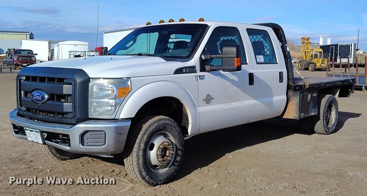 image for item DT0949 2016 Ford F350 Super Duty  Crew Cab flatbed pickup truck