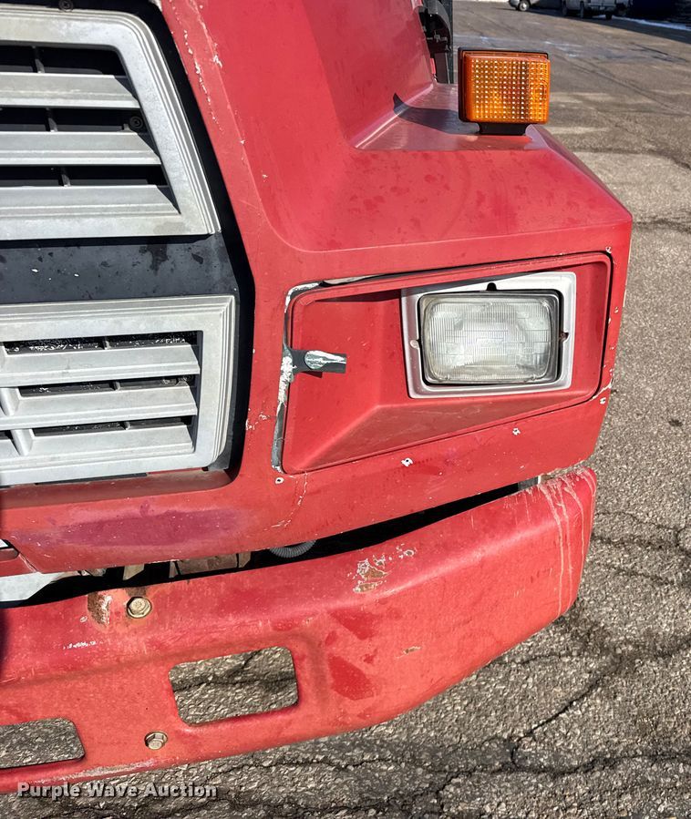 image for item FB0712 1994 Ford F600 flatbed truck