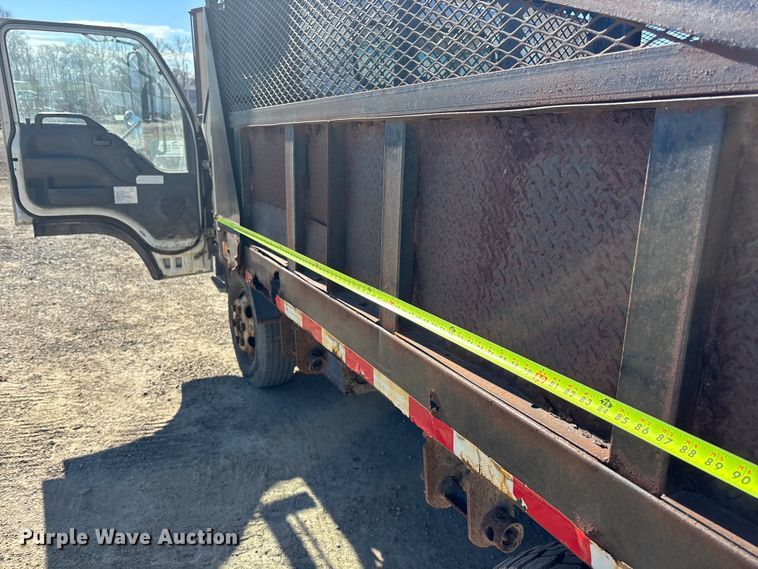 image for item FO3569 1999 Isuzu NPR dump flatbed truck