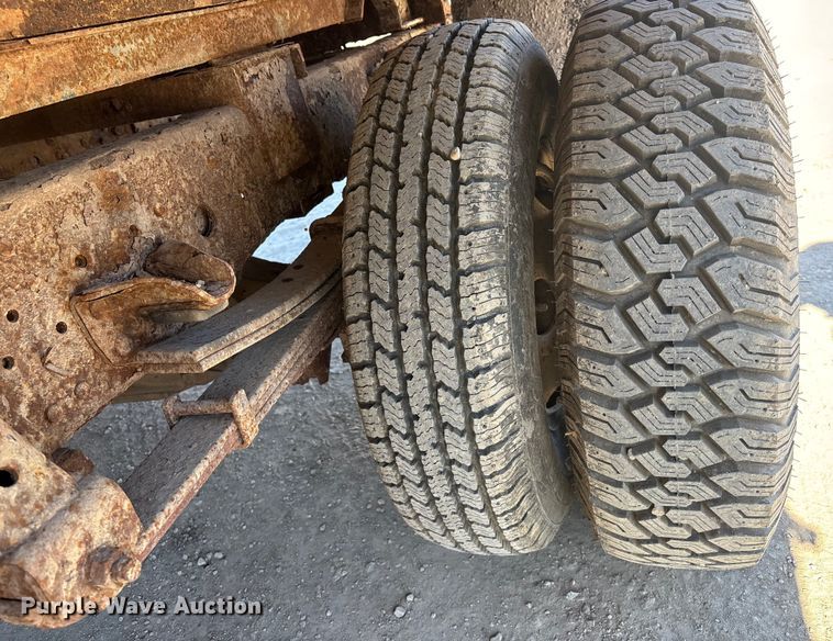 image for item FO3569 1999 Isuzu NPR dump flatbed truck