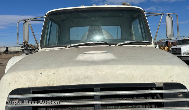 image for item ES1024 1985 Ford L7000 hook lift truck with tank